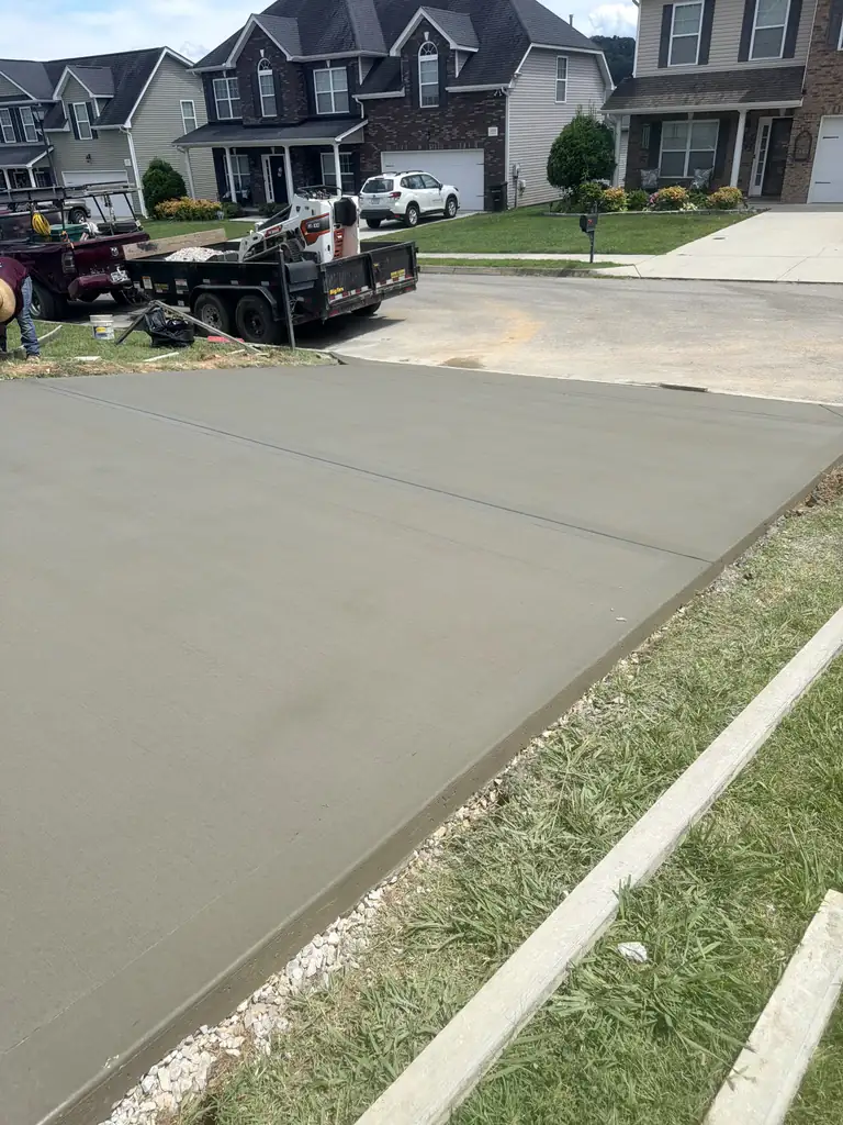 Wide finished concrete driveway at a suburban home in Knoxville, Tennessee