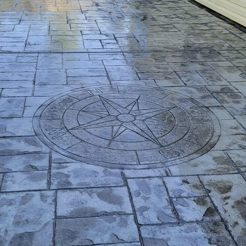 Custom compass rose medallion stamped into concrete in Knoxville, Tennessee