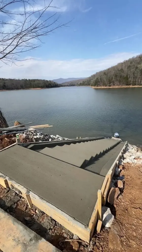 Concrete steps poured down to the water at a lakefront property near Knoxville, Tennessee