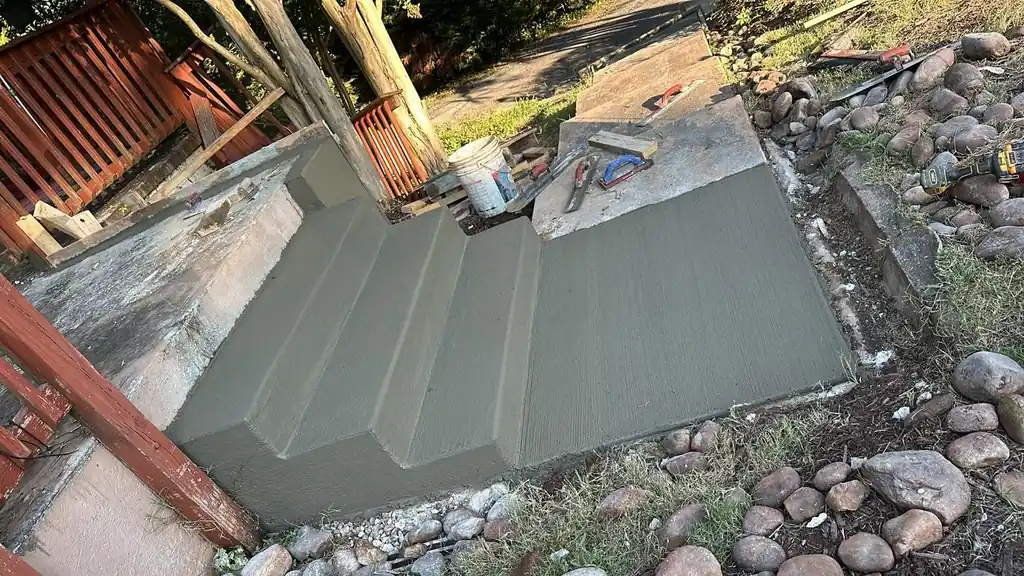 Freshly poured concrete steps set between stone walls in Knoxville, Tennessee